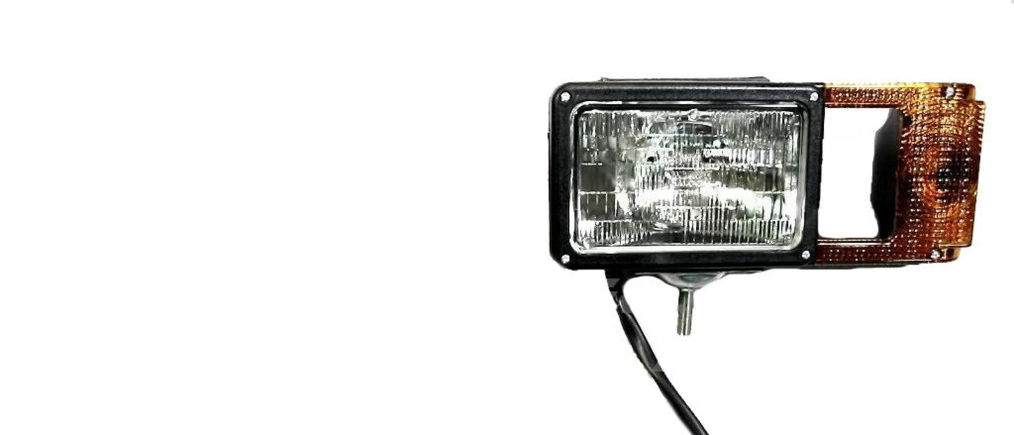 Car headlight assembly with clear lens and amber reflector on a white background