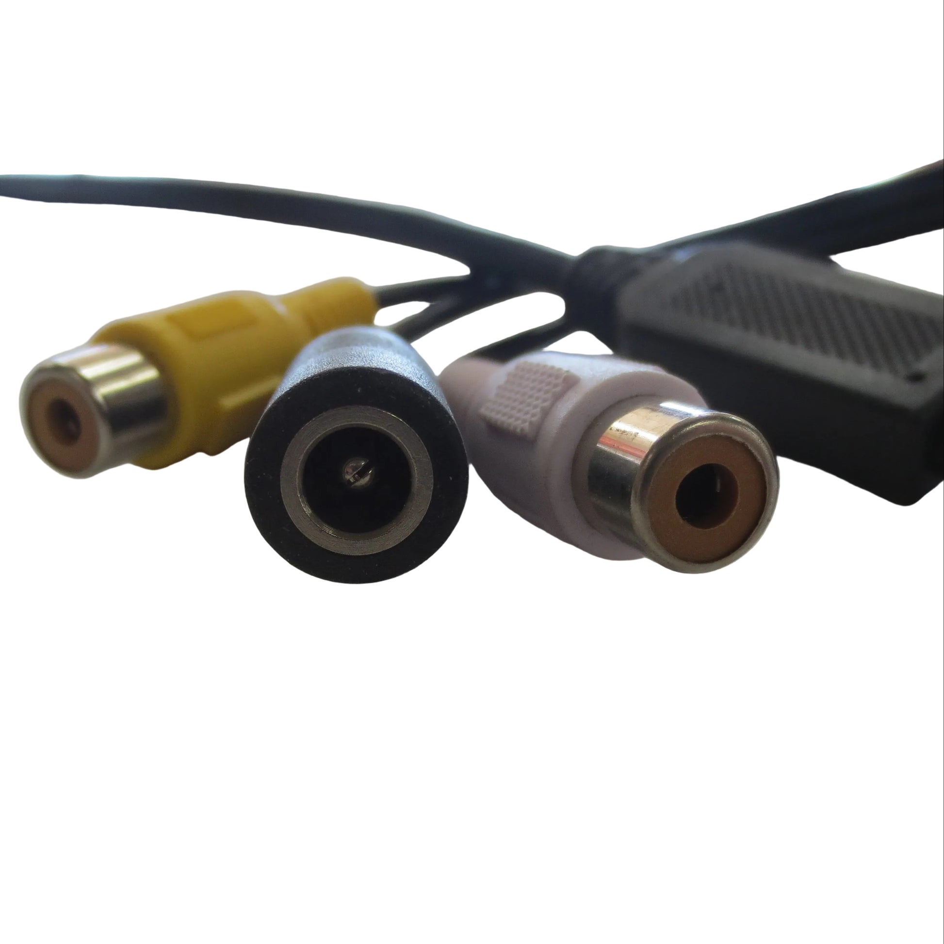Three video connectors on a white surface with a blurred background