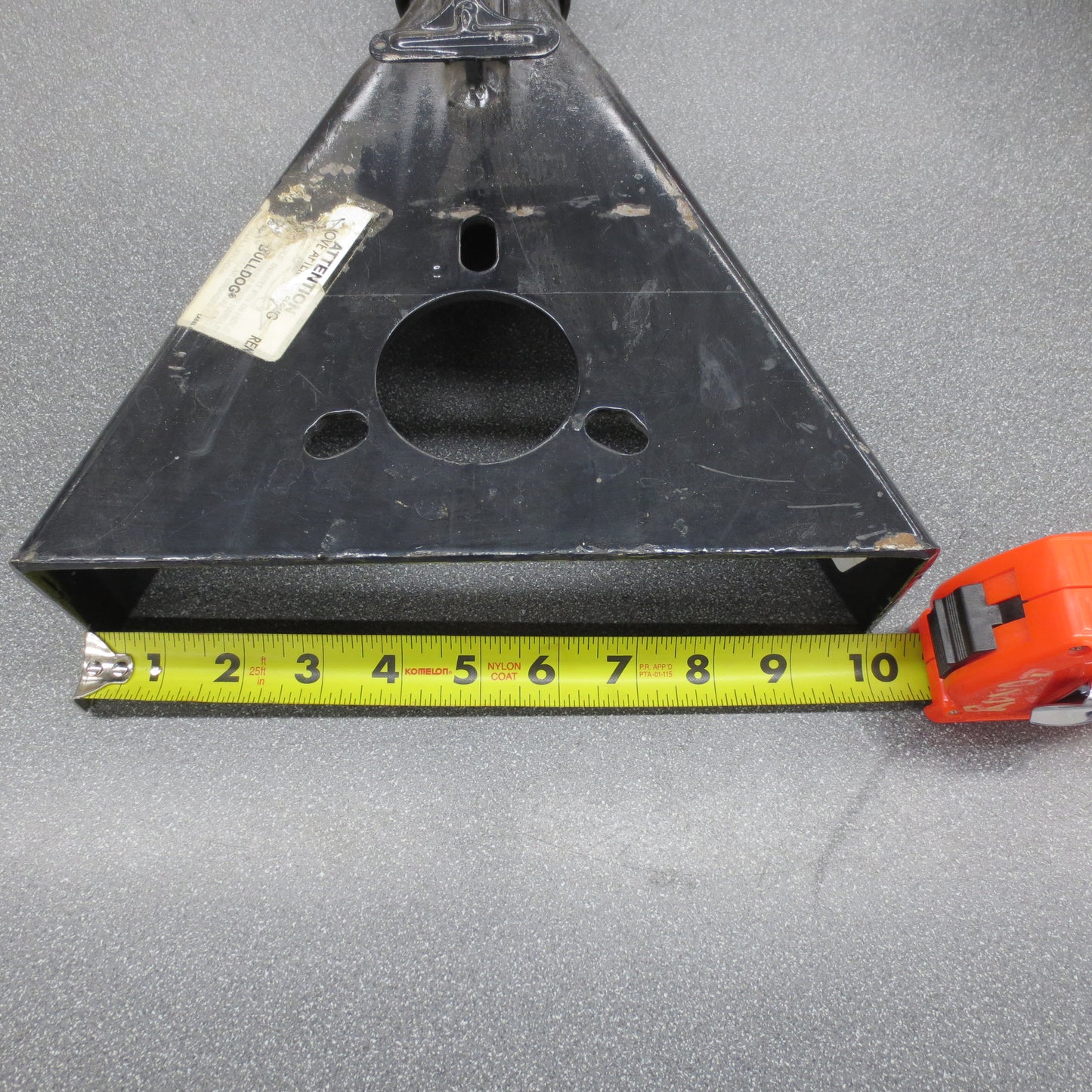 Rear view of A-frame coupler with measuring tape.