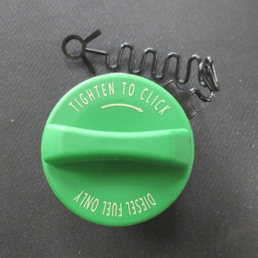 Green fuel cap with text 'Tighten to Click' and 'Diesle Fuel Only' on a black background