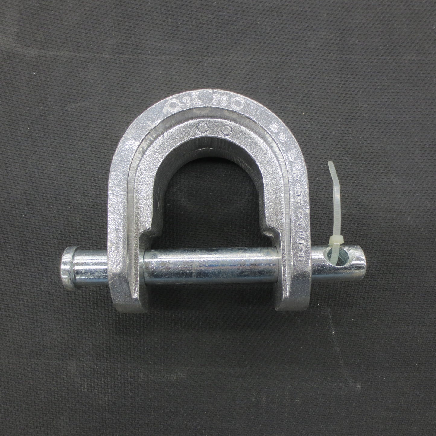 Metal king pin lock on a black background