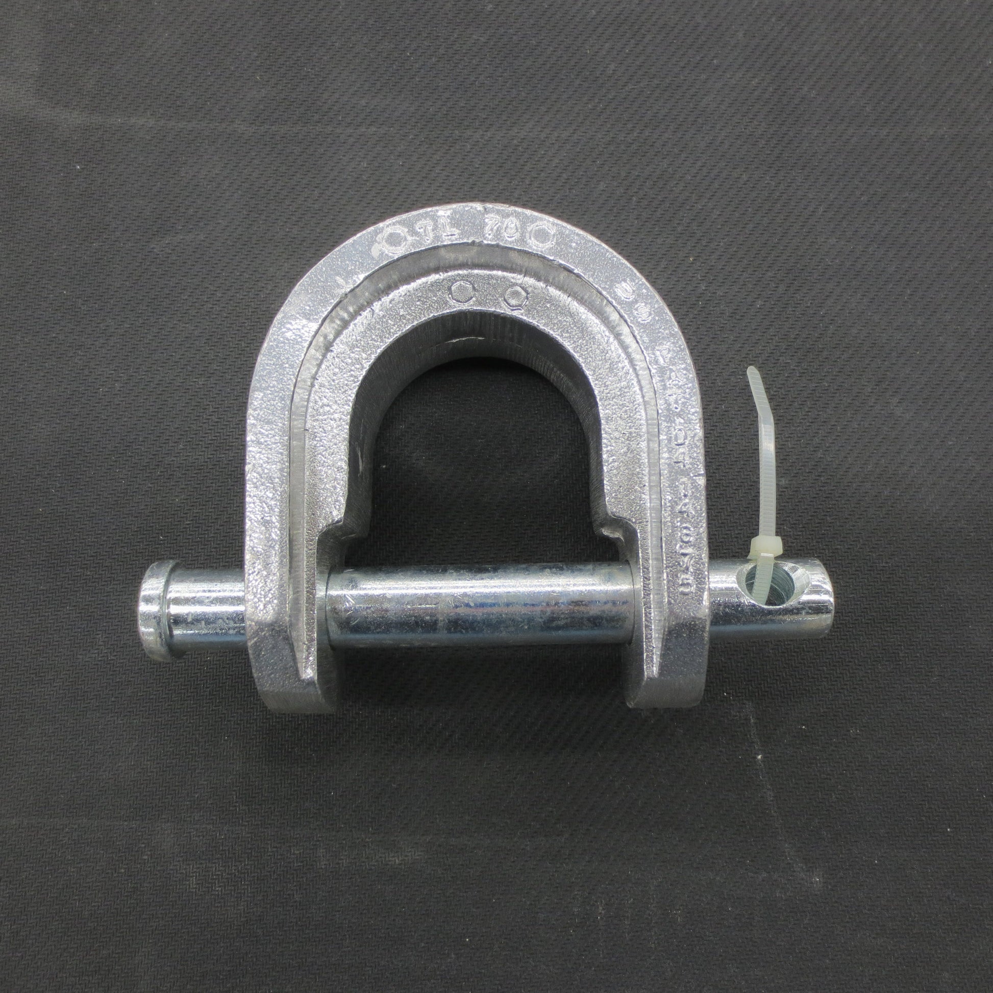 Metal king pin lock on a black background