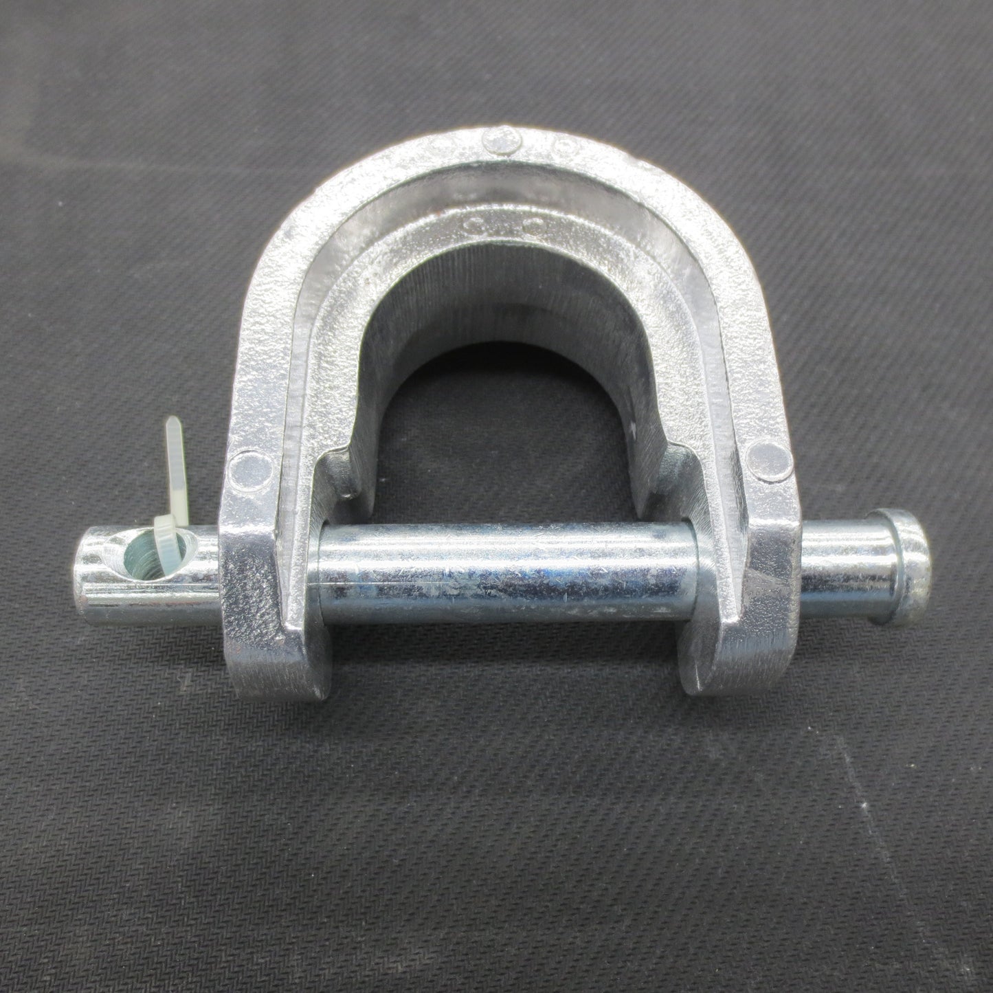 Metal king pin lock on a black background