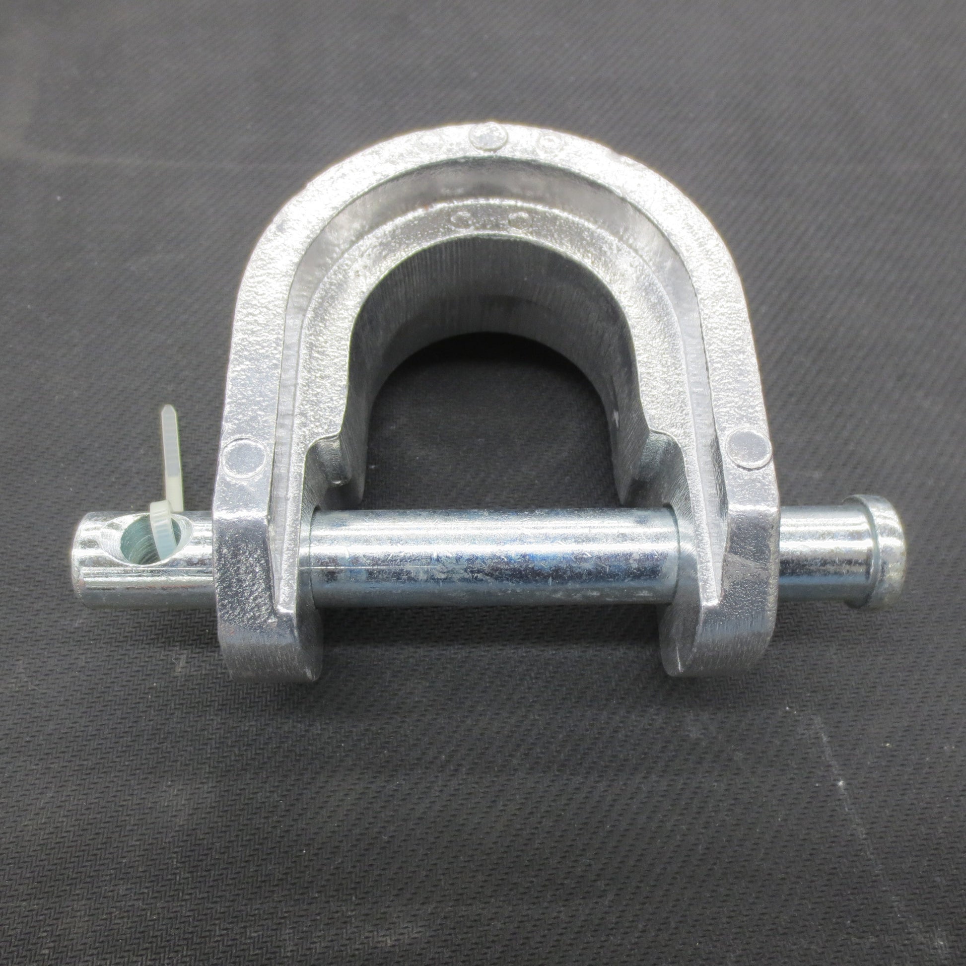 Metal king pin lock on a black background
