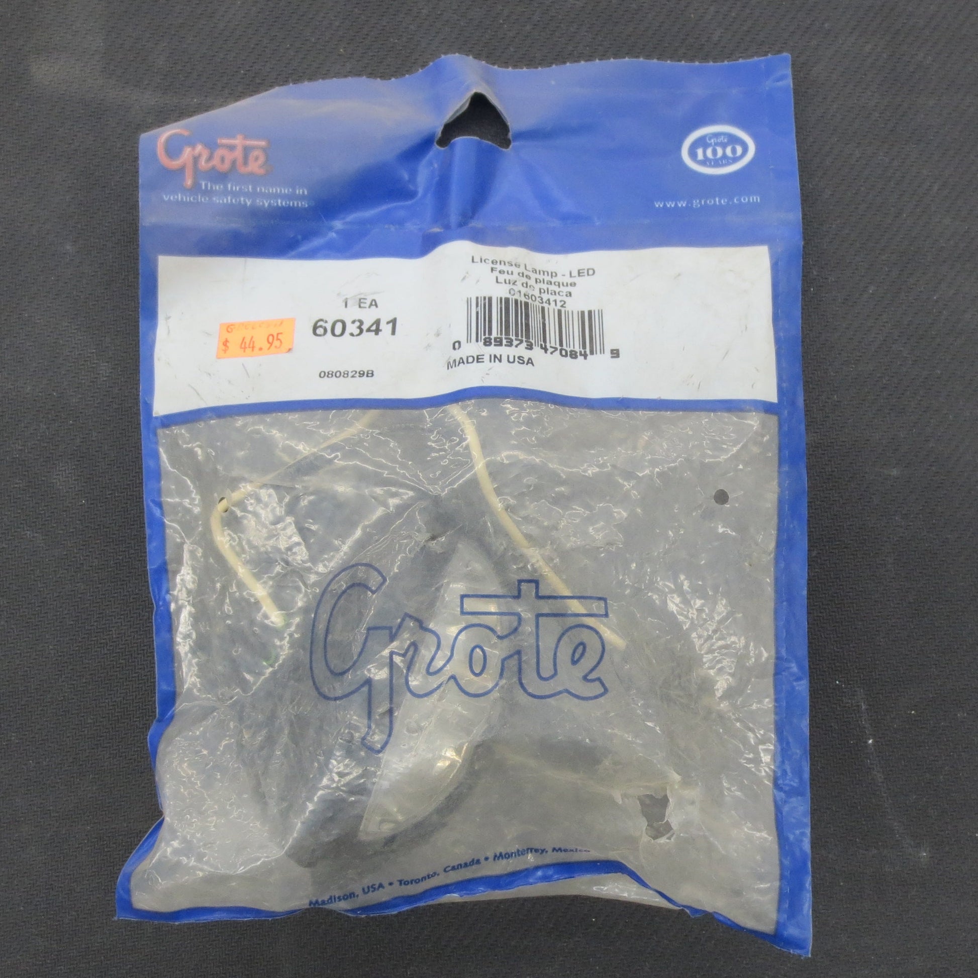 License plate light in package on a dark background