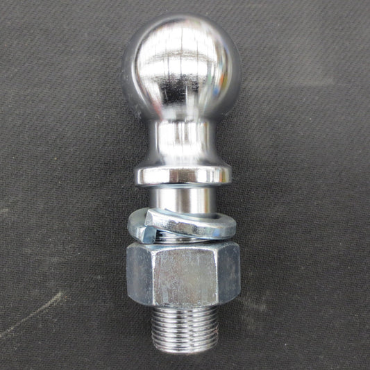 Metal trailer hitch ball on a gray background