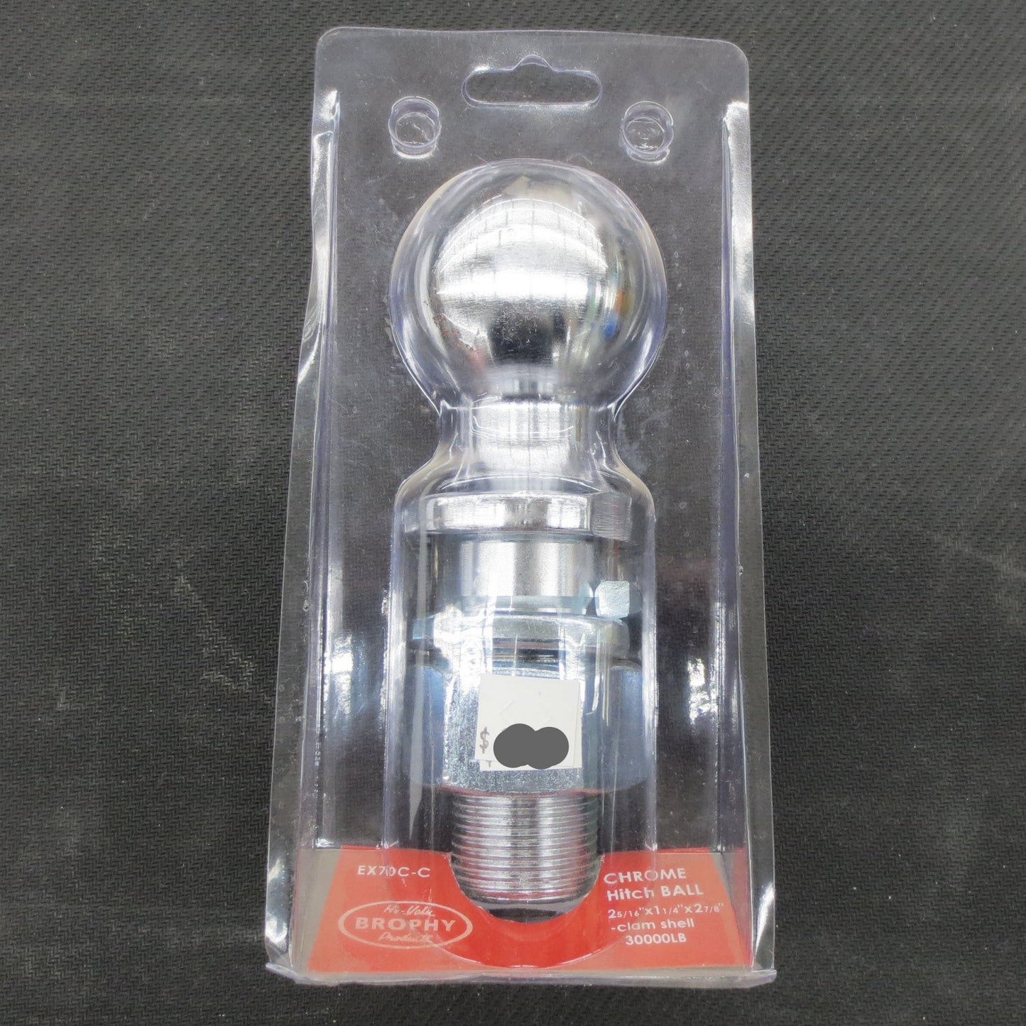 Chrome ball hitch in clear packaging on a dark textured background