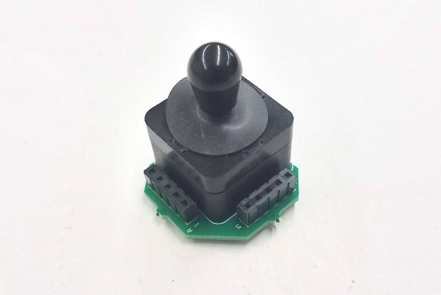 A black joystick switch with a green circuit board designed for use with Hiniker snowplow controllers.